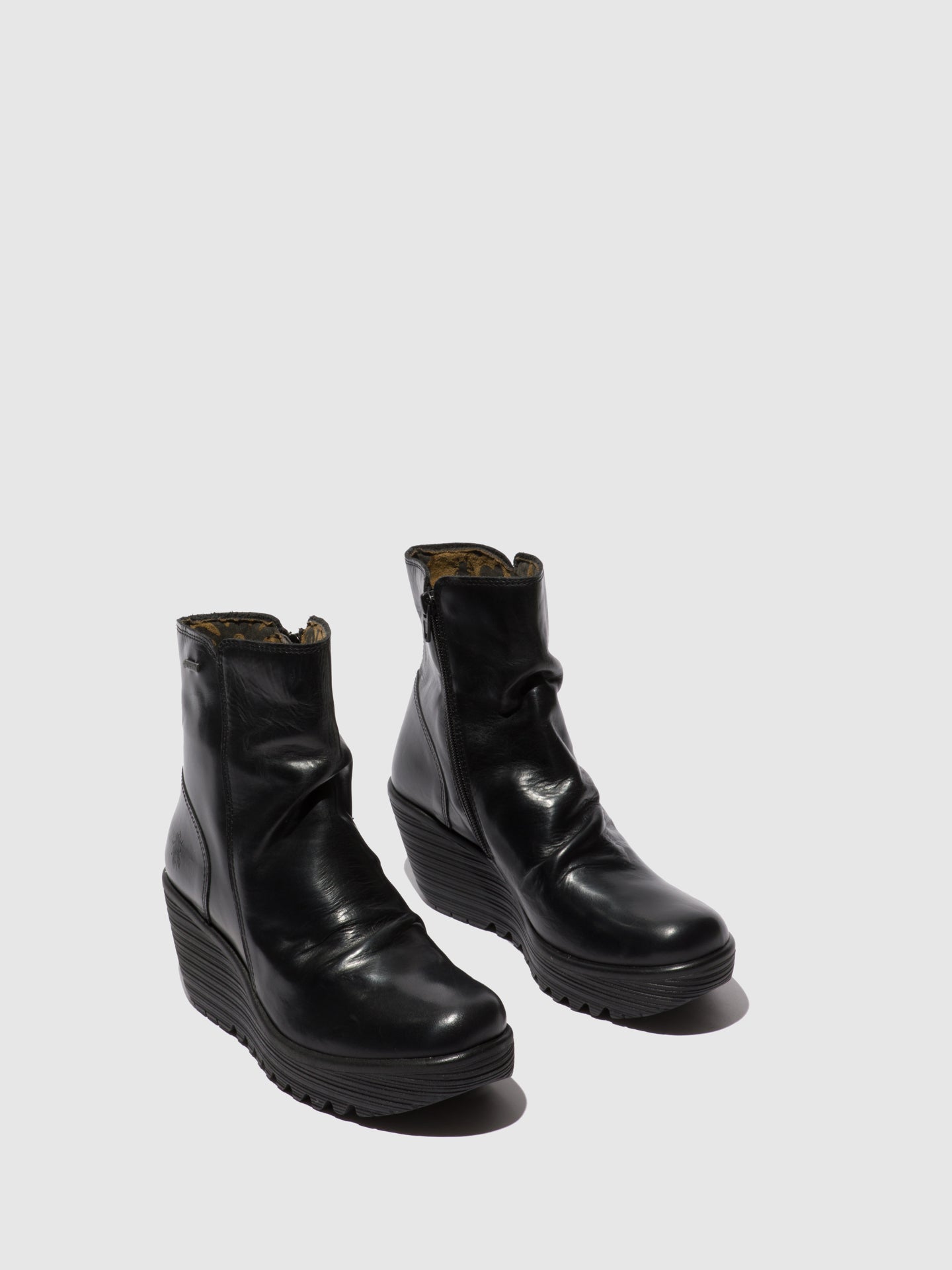 fly london zip up ankle boots